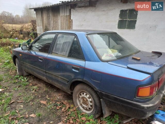 Синий Мазда 323, объемом двигателя 1.3 л и пробегом 240 тыс. км за 400 $, фото 1 на Automoto.ua
