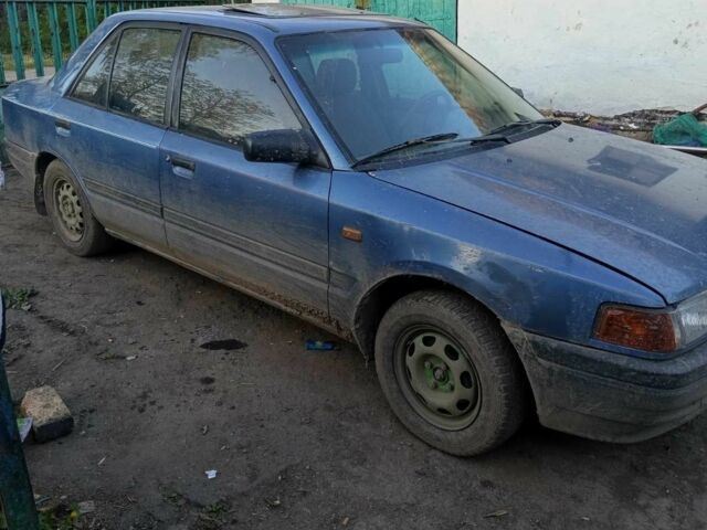 Синий Мазда 323, объемом двигателя 1.3 л и пробегом 323 тыс. км за 558 $, фото 1 на Automoto.ua