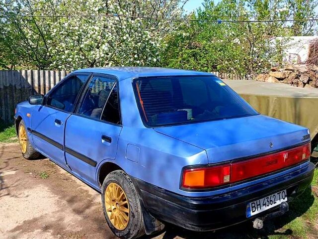 Синій Мазда 323, об'ємом двигуна 1.3 л та пробігом 0 тис. км за 1000 $, фото 1 на Automoto.ua