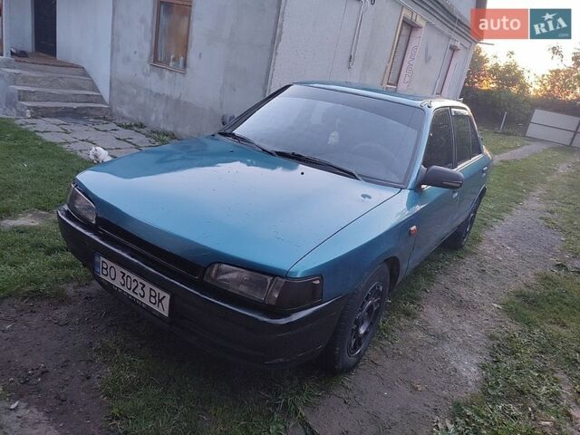 Синий Мазда 323, объемом двигателя 1.7 л и пробегом 500 тыс. км за 1200 $, фото 1 на Automoto.ua