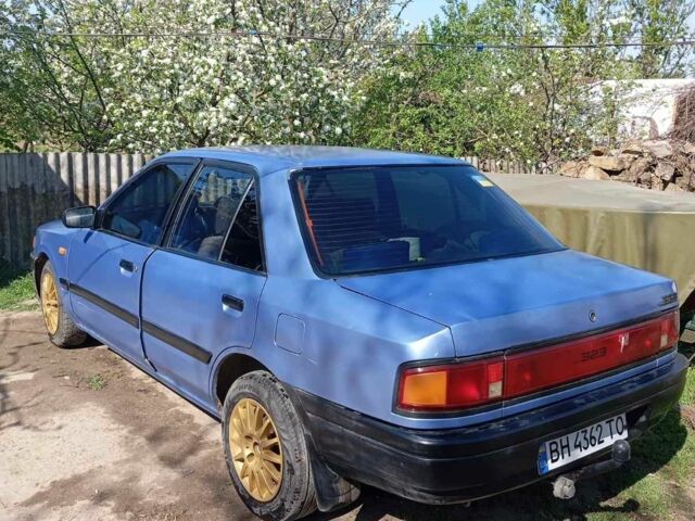 Синій Мазда 323, об'ємом двигуна 1.3 л та пробігом 322 тис. км за 1000 $, фото 1 на Automoto.ua