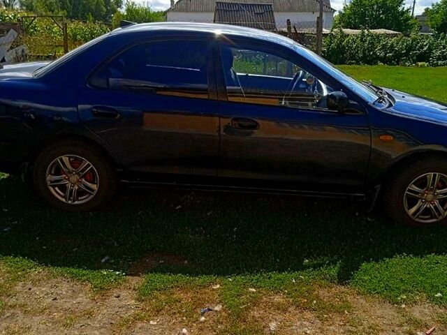 Синий Мазда 323, объемом двигателя 1.3 л и пробегом 429 тыс. км за 2100 $, фото 1 на Automoto.ua