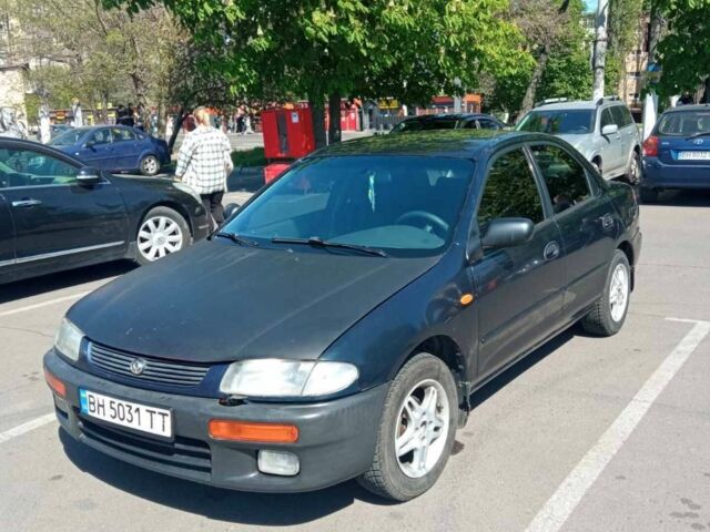 Синий Мазда 323, объемом двигателя 1.49 л и пробегом 310 тыс. км за 2000 $, фото 1 на Automoto.ua