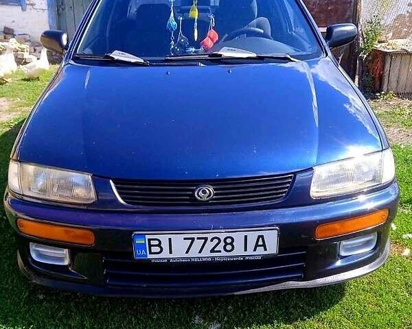 Синий Мазда 323, объемом двигателя 1.3 л и пробегом 429 тыс. км за 2100 $, фото 1 на Automoto.ua