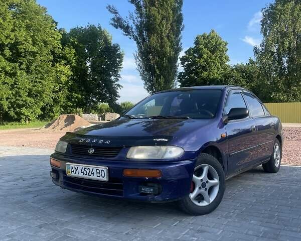 Синий Мазда 323, объемом двигателя 1.5 л и пробегом 380 тыс. км за 1400 $, фото 1 на Automoto.ua