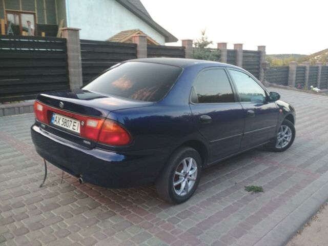 Синий Мазда 323, объемом двигателя 1.3 л и пробегом 280 тыс. км за 3150 $, фото 1 на Automoto.ua
