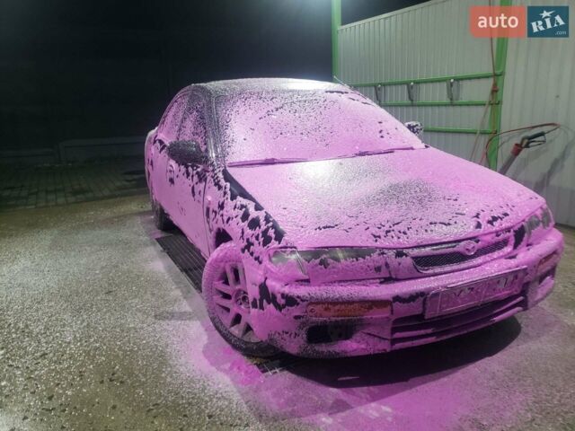 Синий Мазда 323, объемом двигателя 1.5 л и пробегом 430 тыс. км за 1300 $, фото 1 на Automoto.ua