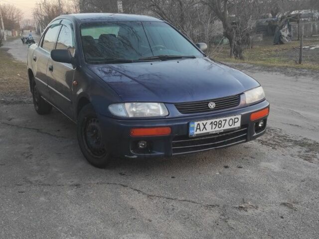 Синій Мазда 323, об'ємом двигуна 1.8 л та пробігом 352 тис. км за 1500 $, фото 1 на Automoto.ua