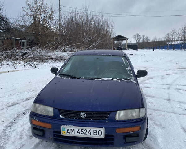 Синий Мазда 323, объемом двигателя 1.5 л и пробегом 250 тыс. км за 999 $, фото 1 на Automoto.ua