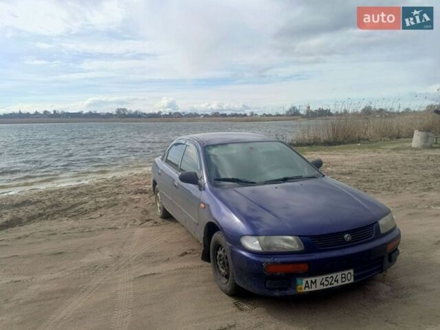 Синий Мазда 323, объемом двигателя 1.5 л и пробегом 680 тыс. км за 1100 $, фото 1 на Automoto.ua