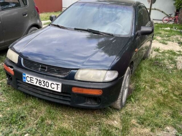 Синій Мазда 323, об'ємом двигуна 1.3 л та пробігом 300 тис. км за 2400 $, фото 1 на Automoto.ua