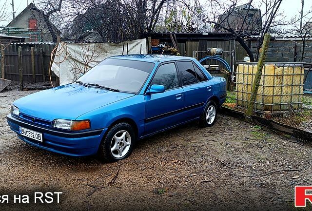 Синий Мазда 323, объемом двигателя 1.6 л и пробегом 425 тыс. км за 1500 $, фото 1 на Automoto.ua