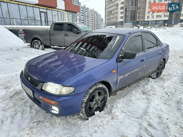 Синий Мазда 323, объемом двигателя 1.49 л и пробегом 250 тыс. км за 1000 $, фото 1 на Automoto.ua