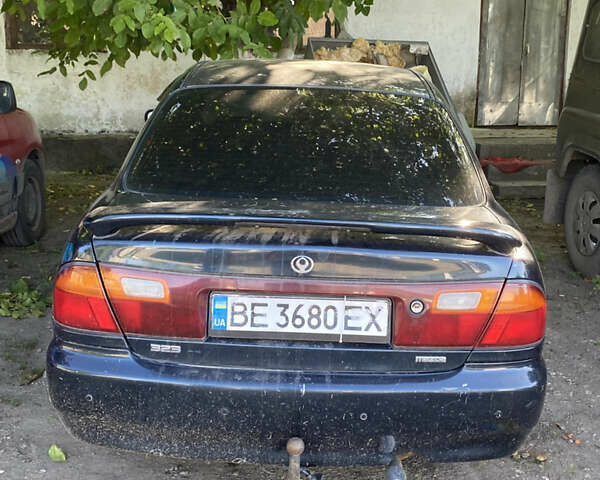 Синій Мазда 323, об'ємом двигуна 1.3 л та пробігом 395 тис. км за 1750 $, фото 1 на Automoto.ua