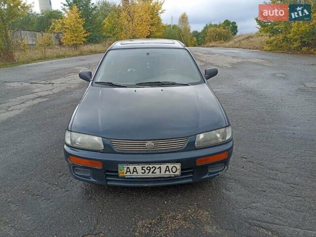 Синий Мазда 323, объемом двигателя 1.49 л и пробегом 250 тыс. км за 1450 $, фото 1 на Automoto.ua