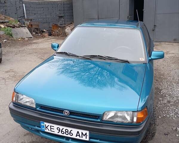 Синий Мазда 323, объемом двигателя 1.6 л и пробегом 159 тыс. км за 3000 $, фото 1 на Automoto.ua