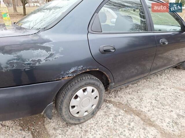 Синий Мазда 323, объемом двигателя 1.49 л и пробегом 595 тыс. км за 1250 $, фото 1 на Automoto.ua