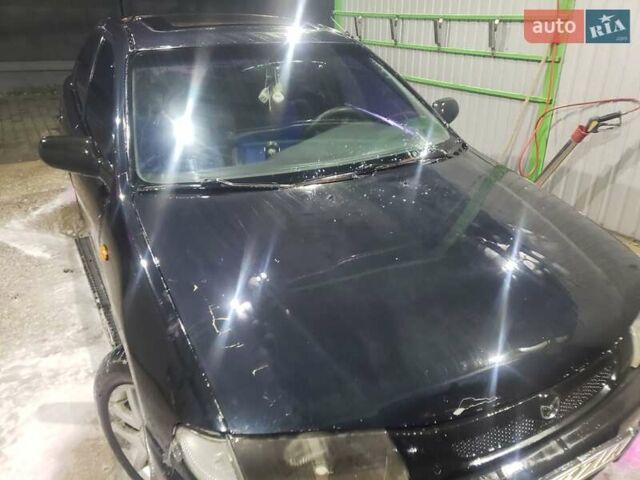 Синій Мазда 323, об'ємом двигуна 1.5 л та пробігом 430 тис. км за 1300 $, фото 1 на Automoto.ua