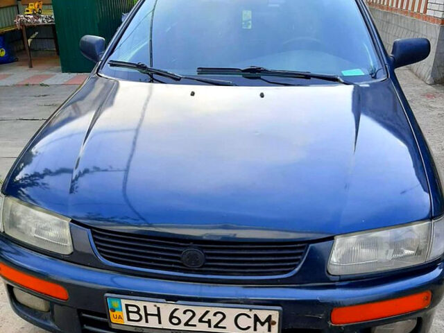 Синий Мазда 323, объемом двигателя 1.5 л и пробегом 402 тыс. км за 2500 $, фото 1 на Automoto.ua