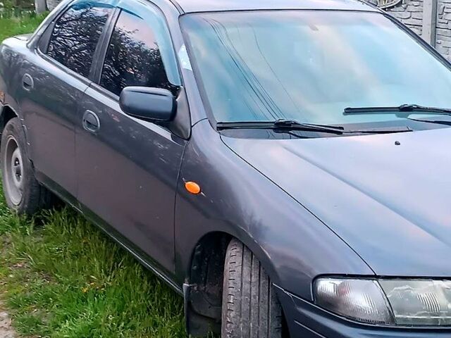 Синій Мазда 323, об'ємом двигуна 1.8 л та пробігом 0 тис. км за 1600 $, фото 1 на Automoto.ua