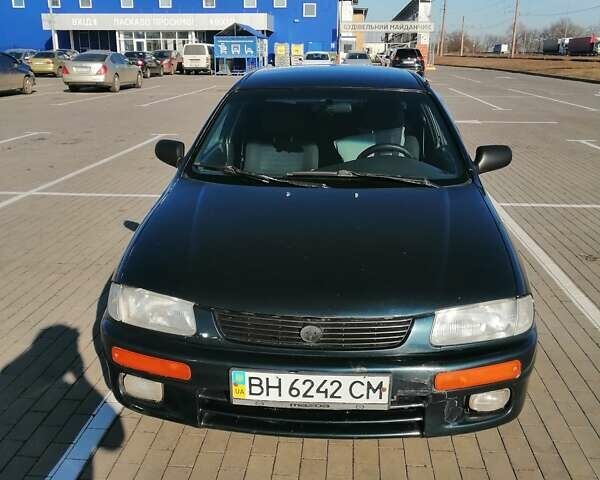 Синій Мазда 323, об'ємом двигуна 1.49 л та пробігом 100 тис. км за 2650 $, фото 1 на Automoto.ua