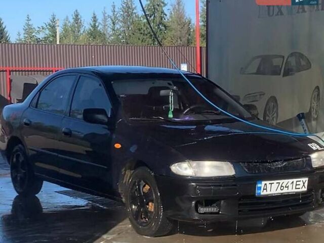 Синий Мазда 323, объемом двигателя 1.5 л и пробегом 500 тыс. км за 700 $, фото 1 на Automoto.ua