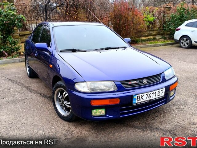 Синий Мазда 323, объемом двигателя 1.5 л и пробегом 342 тыс. км за 2600 $, фото 1 на Automoto.ua