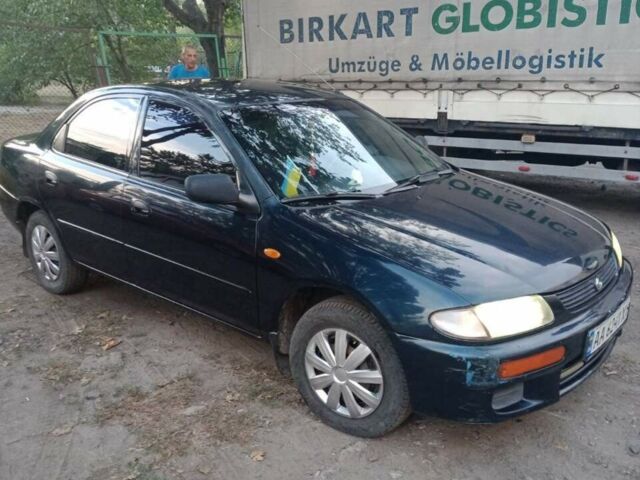 Синий Мазда 323, объемом двигателя 1.5 л и пробегом 297 тыс. км за 2500 $, фото 1 на Automoto.ua