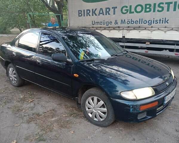 Синий Мазда 323, объемом двигателя 1.5 л и пробегом 297 тыс. км за 2500 $, фото 1 на Automoto.ua