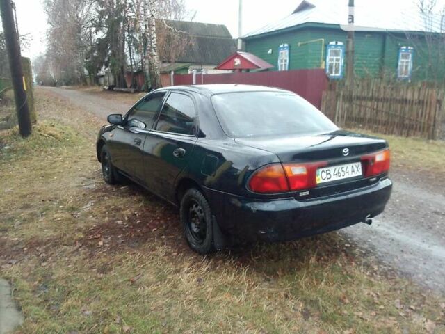 Синий Мазда 323, объемом двигателя 1.5 л и пробегом 323 тыс. км за 1300 $, фото 1 на Automoto.ua