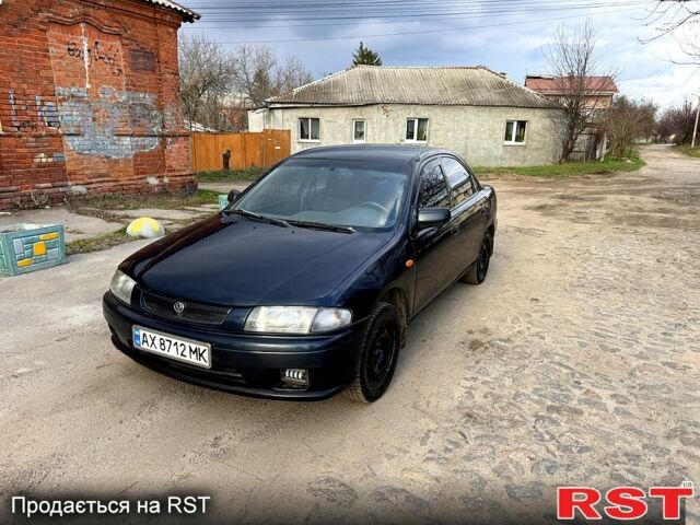 Синий Мазда 323, объемом двигателя 1.5 л и пробегом 200 тыс. км за 1750 $, фото 1 на Automoto.ua
