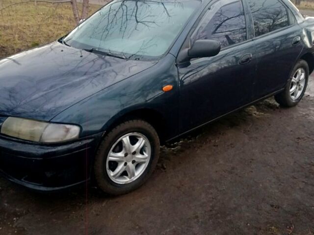 Синий Мазда 323, объемом двигателя 1.5 л и пробегом 500 тыс. км за 1500 $, фото 1 на Automoto.ua