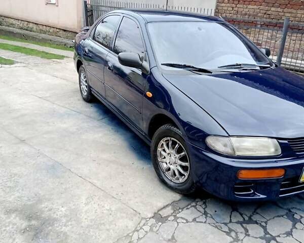 Синий Мазда 323, объемом двигателя 1.49 л и пробегом 267 тыс. км за 2200 $, фото 1 на Automoto.ua