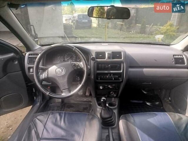 Синий Мазда 323, объемом двигателя 1.5 л и пробегом 315 тыс. км за 1300 $, фото 1 на Automoto.ua