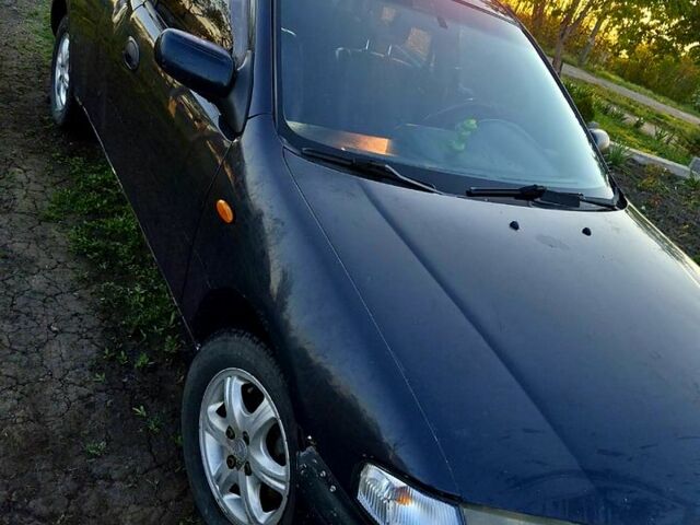 Синий Мазда 323, объемом двигателя 1.5 л и пробегом 0 тыс. км за 1200 $, фото 1 на Automoto.ua