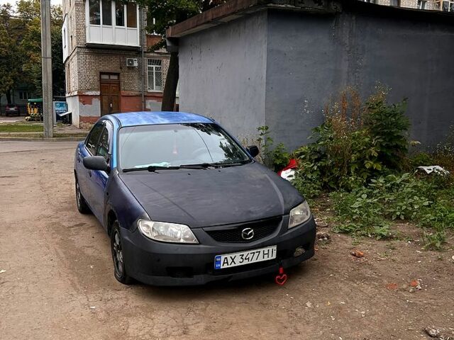Синий Мазда 323, объемом двигателя 1.8 л и пробегом 250 тыс. км за 750 $, фото 1 на Automoto.ua