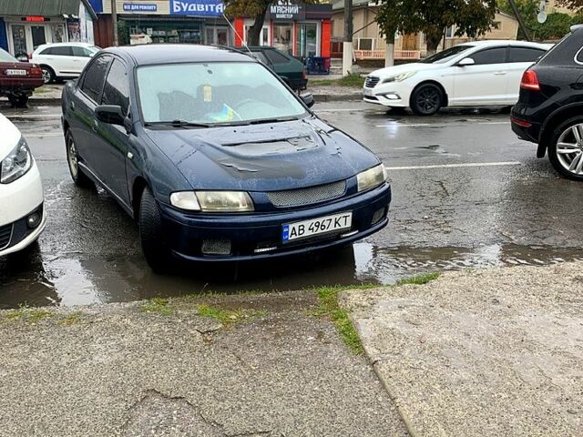 Синий Мазда 323, объемом двигателя 1.5 л и пробегом 320 тыс. км за 1300 $, фото 1 на Automoto.ua