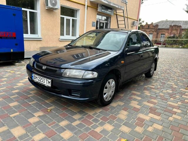 Синій Мазда 323, об'ємом двигуна 1.5 л та пробігом 1 тис. км за 1203 $, фото 1 на Automoto.ua