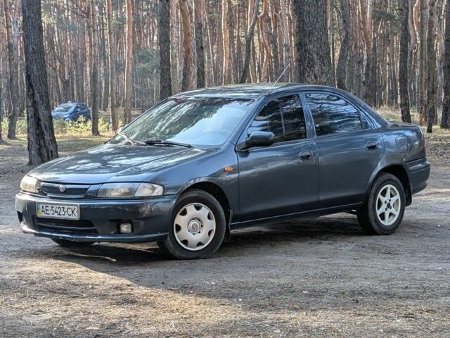 Синий Мазда 323, объемом двигателя 1.5 л и пробегом 400 тыс. км за 1299 $, фото 1 на Automoto.ua