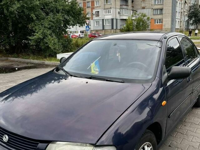Синій Мазда 323, об'ємом двигуна 1.49 л та пробігом 267 тис. км за 1850 $, фото 1 на Automoto.ua