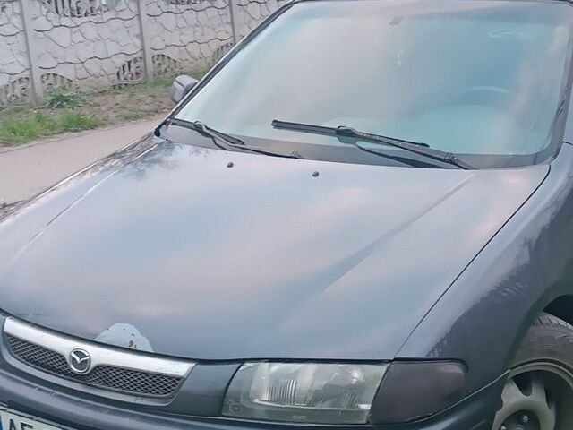 Синий Мазда 323, объемом двигателя 1.8 л и пробегом 440 тыс. км за 1100 $, фото 1 на Automoto.ua