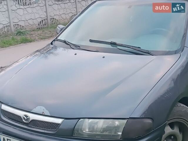 Синий Мазда 323, объемом двигателя 1.8 л и пробегом 440 тыс. км за 1300 $, фото 1 на Automoto.ua