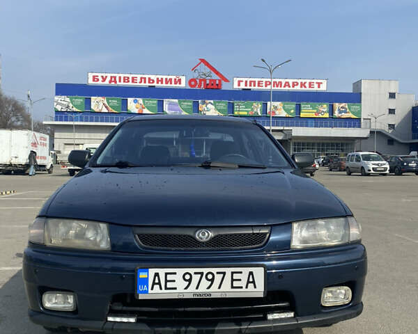 Синий Мазда 323, объемом двигателя 1.5 л и пробегом 330 тыс. км за 3000 $, фото 1 на Automoto.ua