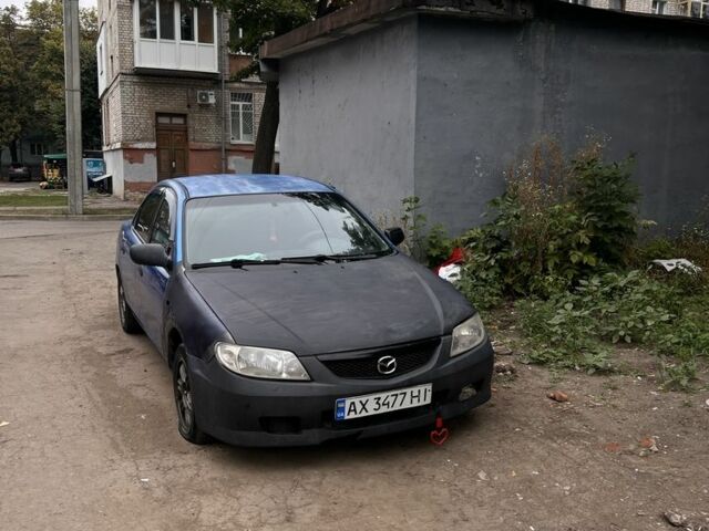 Синій Мазда 323, об'ємом двигуна 1.8 л та пробігом 255 тис. км за 897 $, фото 1 на Automoto.ua