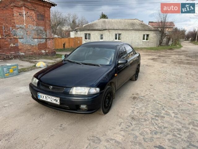 Синій Мазда 323, об'ємом двигуна 1.5 л та пробігом 200 тис. км за 1750 $, фото 1 на Automoto.ua