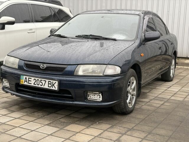 Синий Мазда 323, объемом двигателя 1.5 л и пробегом 230 тыс. км за 4602 $, фото 1 на Automoto.ua