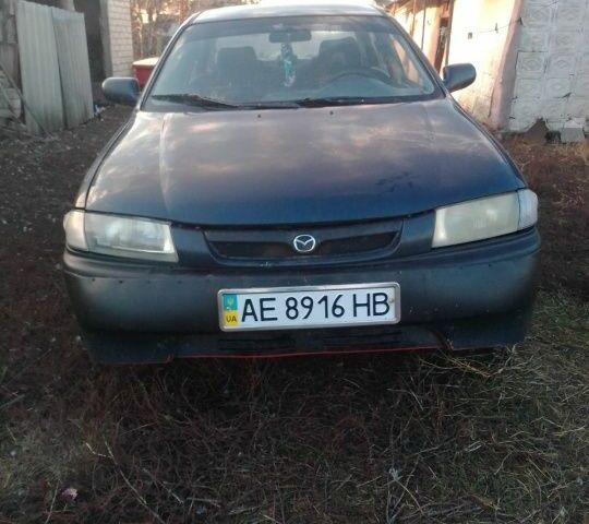 Синий Мазда 323, объемом двигателя 1.5 л и пробегом 387 тыс. км за 1354 $, фото 1 на Automoto.ua