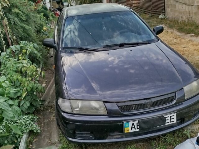 Синий Мазда 323, объемом двигателя 1.5 л и пробегом 400 тыс. км за 2574 $, фото 1 на Automoto.ua