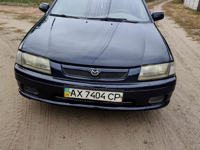 Синий Мазда 323, объемом двигателя 1.5 л и пробегом 285 тыс. км за 2500 $, фото 1 на Automoto.ua