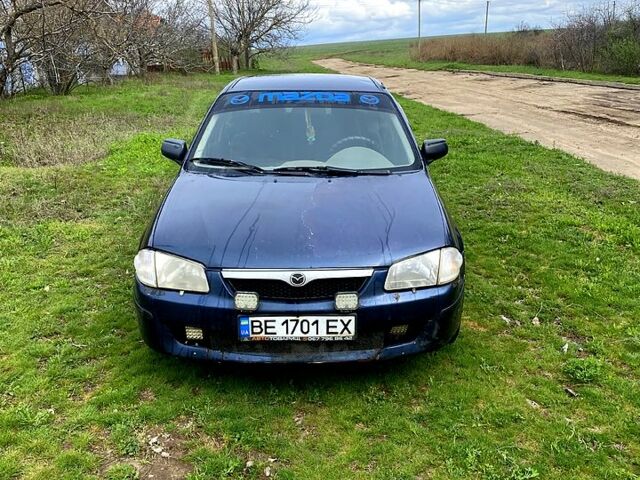 Синий Мазда 323, объемом двигателя 1.5 л и пробегом 300 тыс. км за 1500 $, фото 1 на Automoto.ua